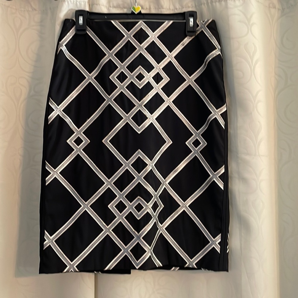 White House Black Market. Skirt 24” long, back zipper. Black, gray, & white.